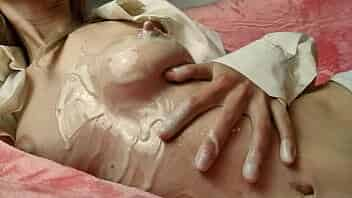 Sexy bitch playing with breast in condensed milk