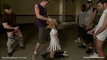 Blonde cheerleader Emma Haize is blindfolded and bound on knees and throat fucked then suspended double penetration interracial fucked by big dicks