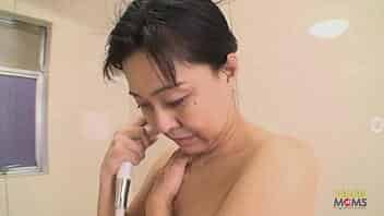 Chubby Japanese mom shows off her curves and lets him touch her inappropriately. The man teases her pussy with a vibrator, and then they hop into the shower before having sex ending with a creampie.