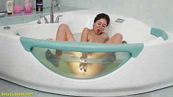 sweet nipple pierced teen Katty West toying her tight cunt under water at the glass bathtub